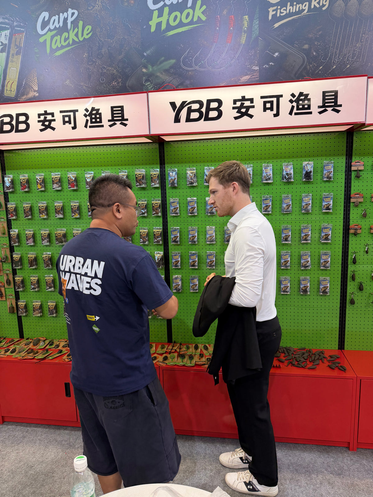 YBB representative speaking with a customer at the exhibition